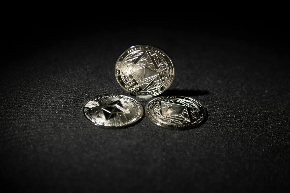 Bitcoin coin on pile of gold dust